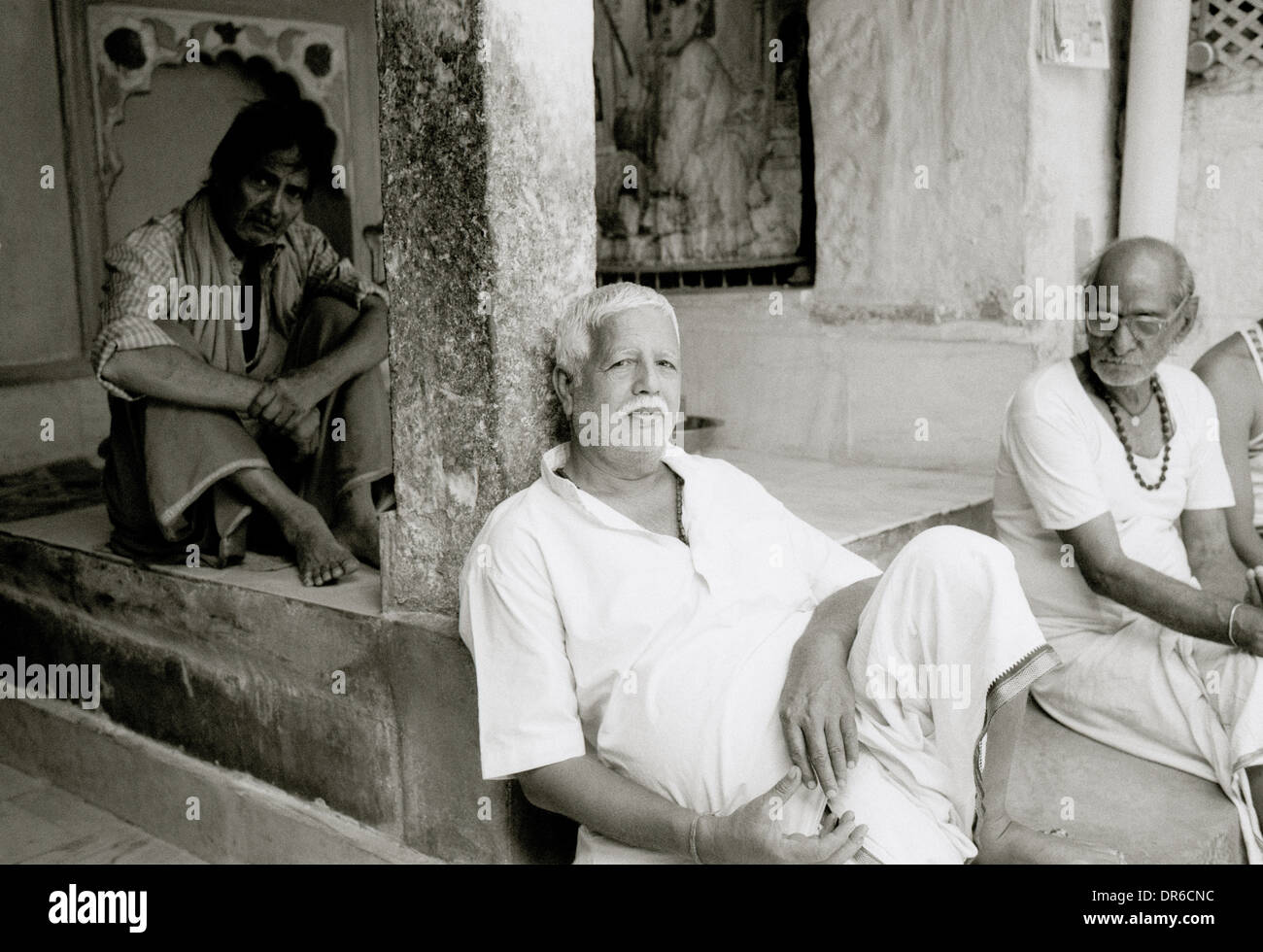 Travel Reportage Photography - Hindu Brahmins in a temple in the blue city Brahmpur old town in Jodhpur in Rajasthan in India in South Asia. People Stock Photo