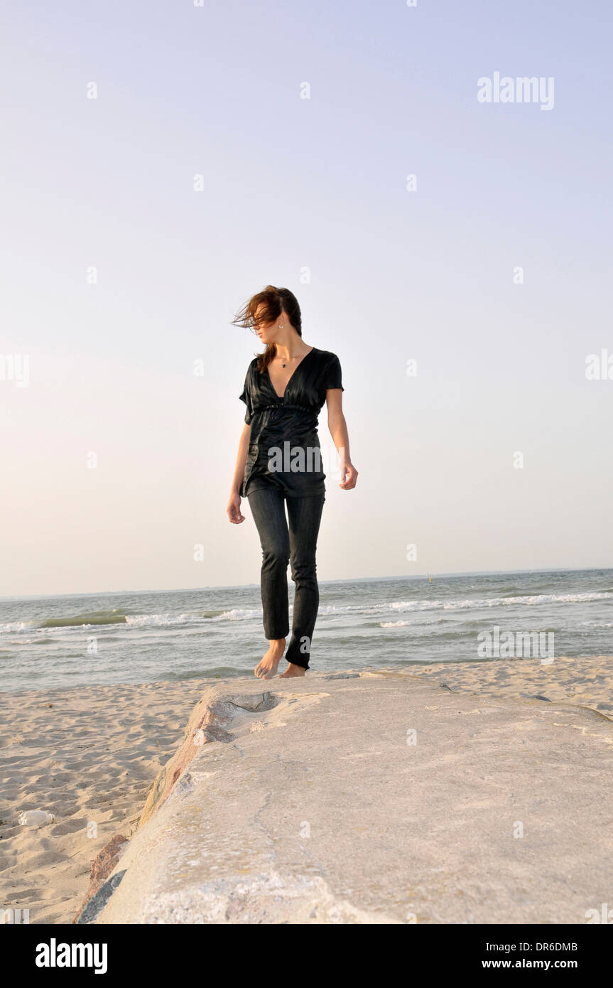 Young woman at the beach, Niendorf, Germany Stock Photo