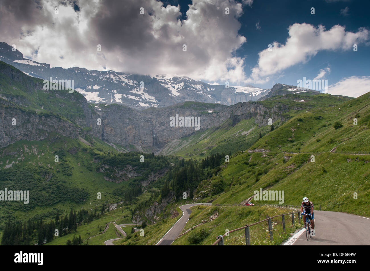 A cyclist climbs the Klausenpass (1948m) on the Klausenstrasse from Urnerboden (eastern approach) on the national cycle route 4 Stock Photo