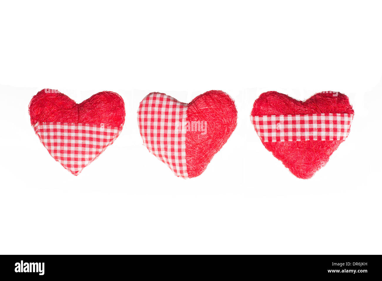 Three Heart Shaped Pillows Isolated On A White Studio Background Stock Photo