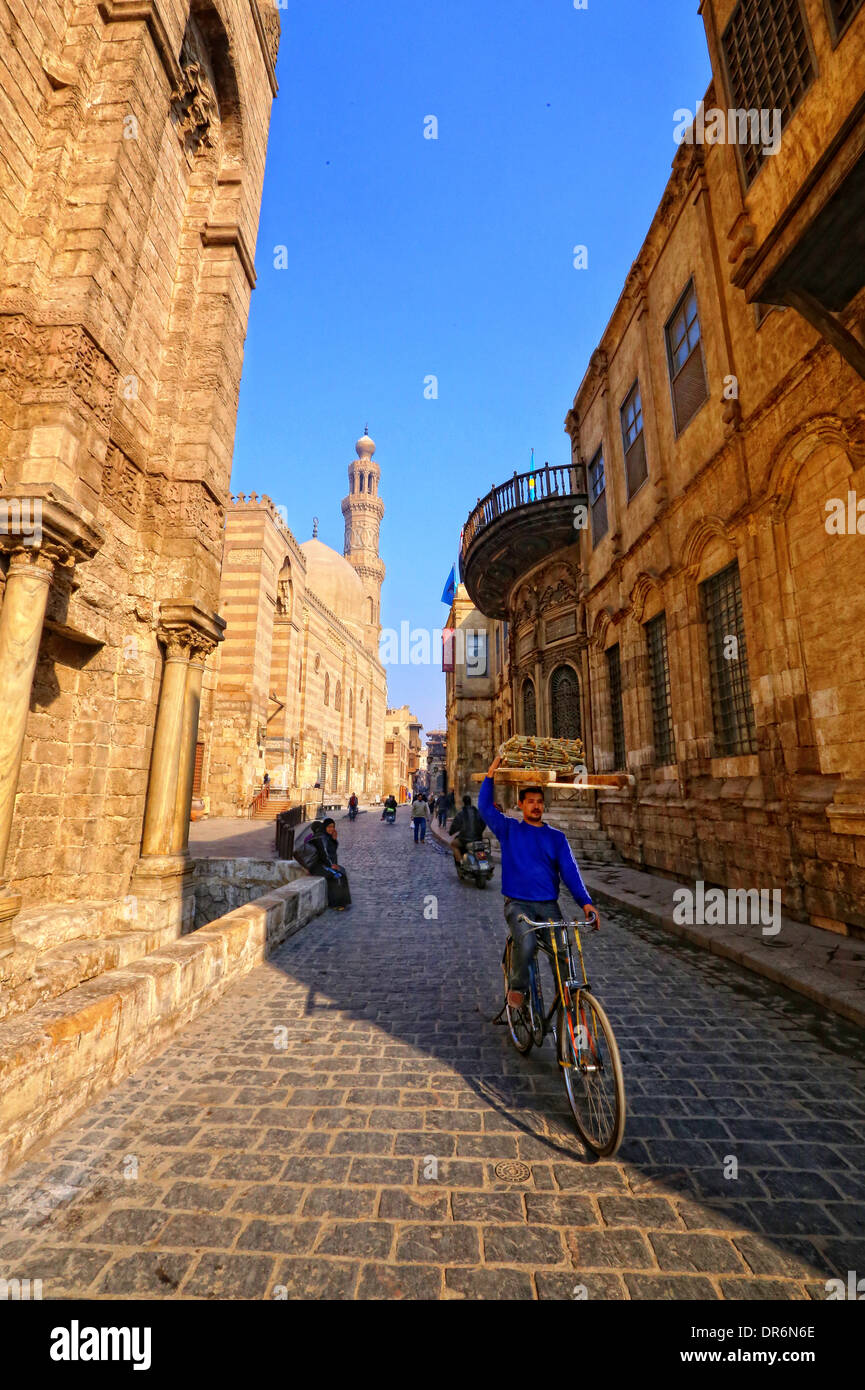 Bike Rider in old Cairo street (Working Early) Stock Photo