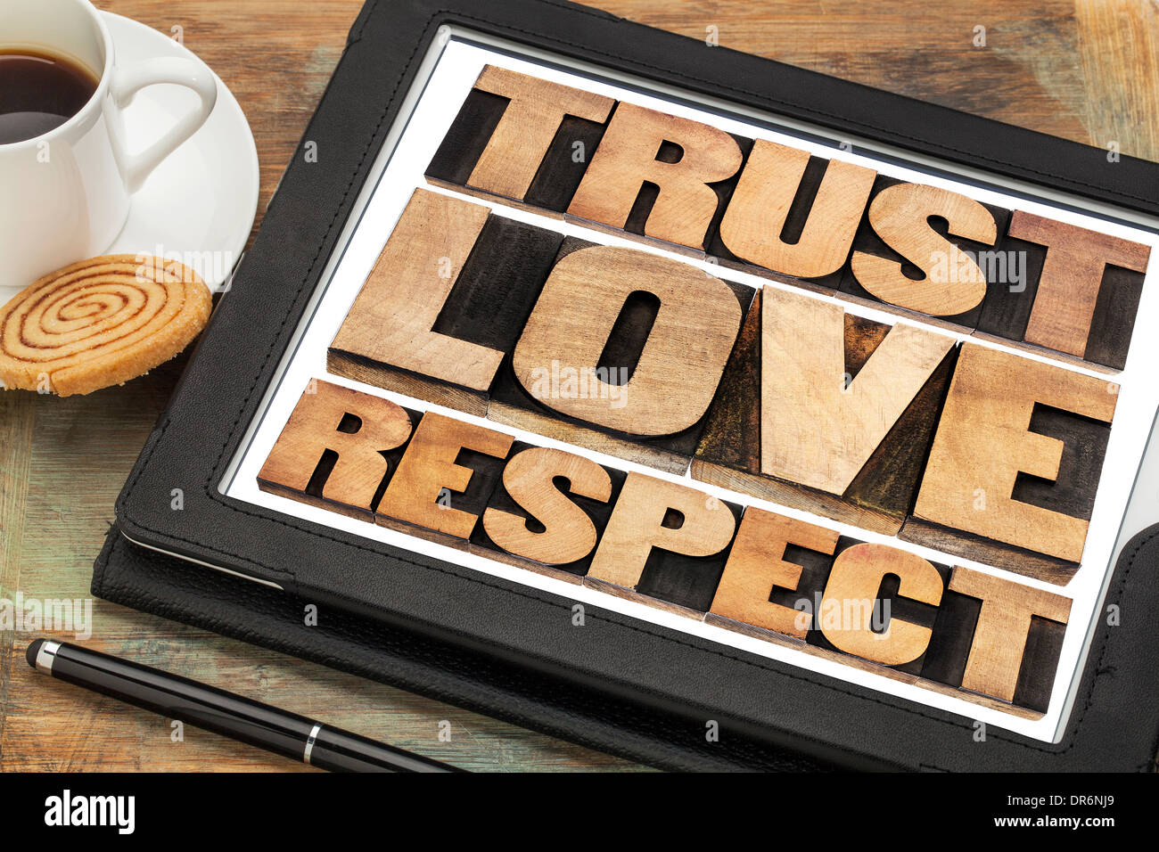 trust, love and respect word abstract in vintage letterpress wood type on a digital tablet Stock Photo
