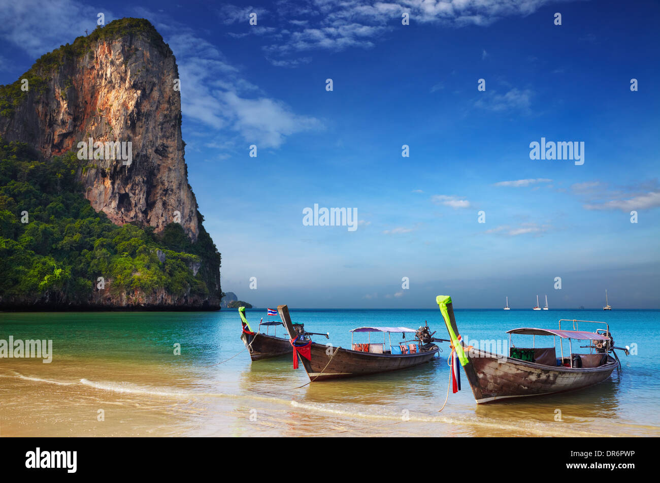 Tropical beach, traditional long tail boats, Andaman Sea, Thailand Stock Photo