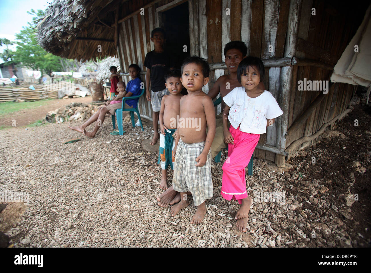 Wide view portrait of Indonesian children from a family living in poverty.  Kupang, West Timor, Indonesia. Nov 2005 Stock Photo