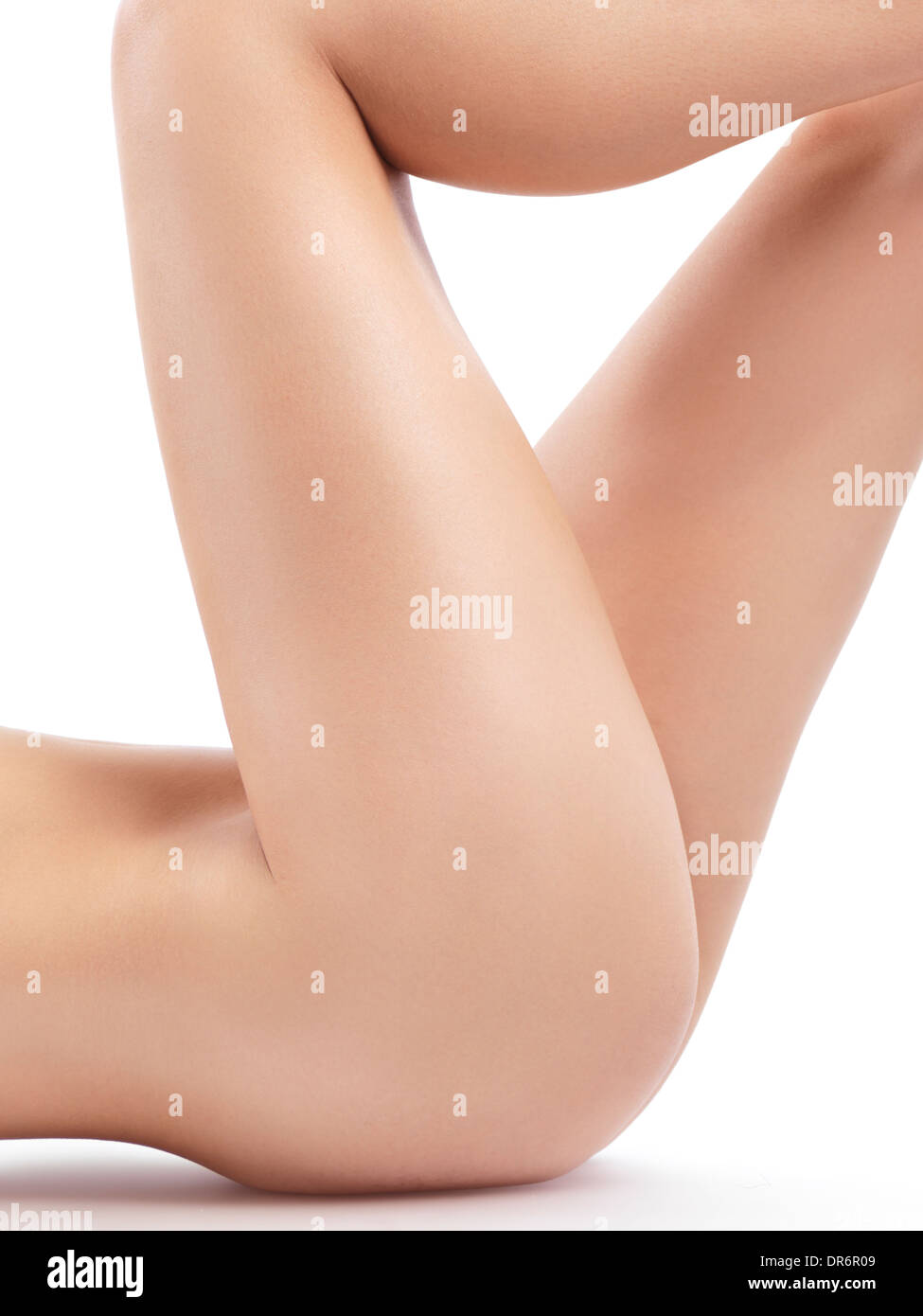 Nude woman bare legs, closeup of thighs with smooth skin isolated on white  background Stock Photo - Alamy