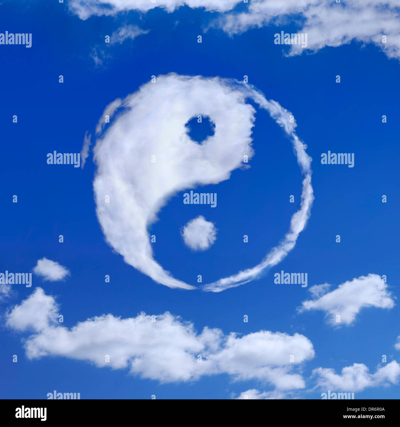 Yin-Yang spiritual symbol made from white clouds in blue sky. Meditation, spirituality concept. Stock Photo