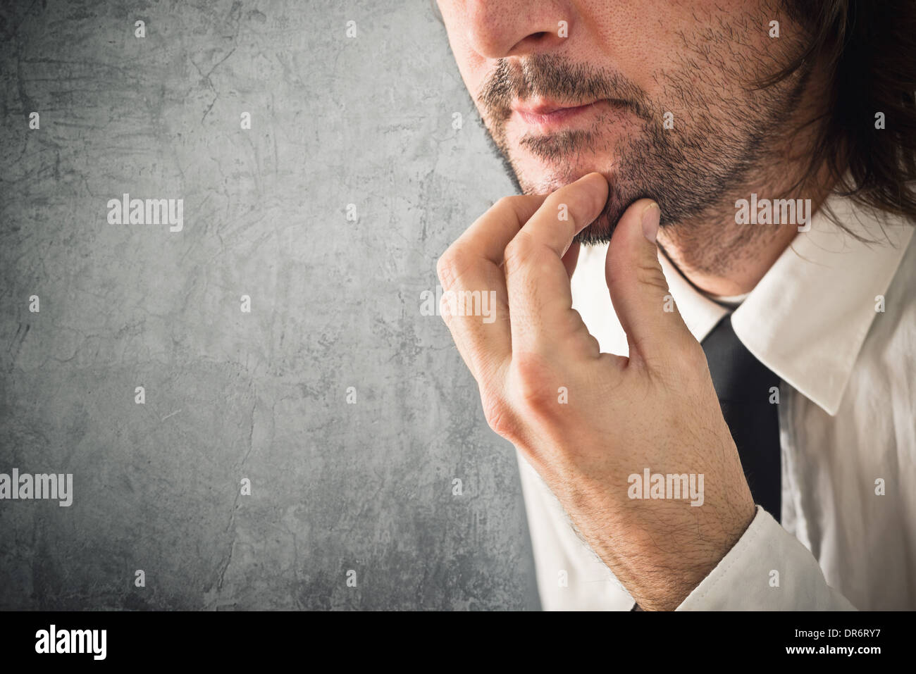 Businessman thinking. Portrait of thoughtful business person. Stock Photo