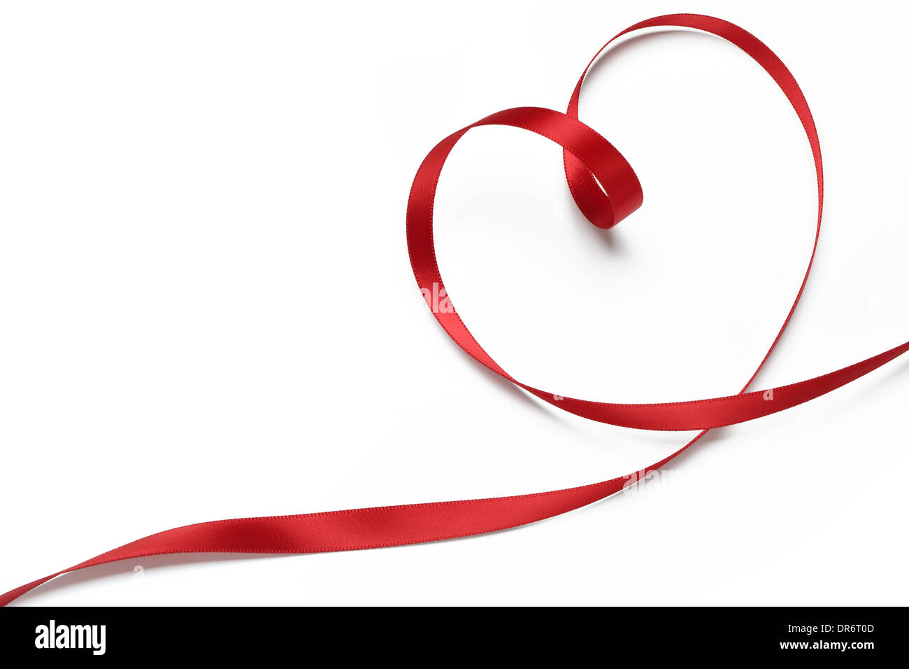Red ribbon in heart shape,valentines concept. Stock Photo