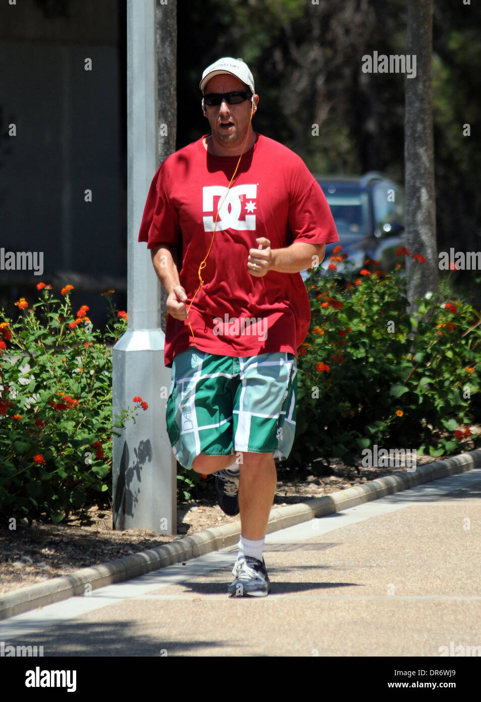 U.S. actor Adam Sandler playing sports on the island of Mallorca in the summer of 2010. Stock Photo