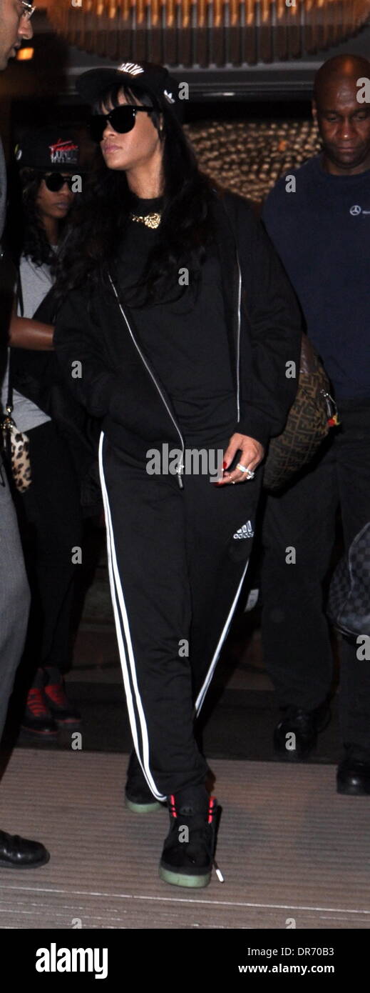 Rihanna exits her hotel wearing an adidas track suit and a Brooklyn hat  London, England - 28.06.12 Stock Photo - Alamy