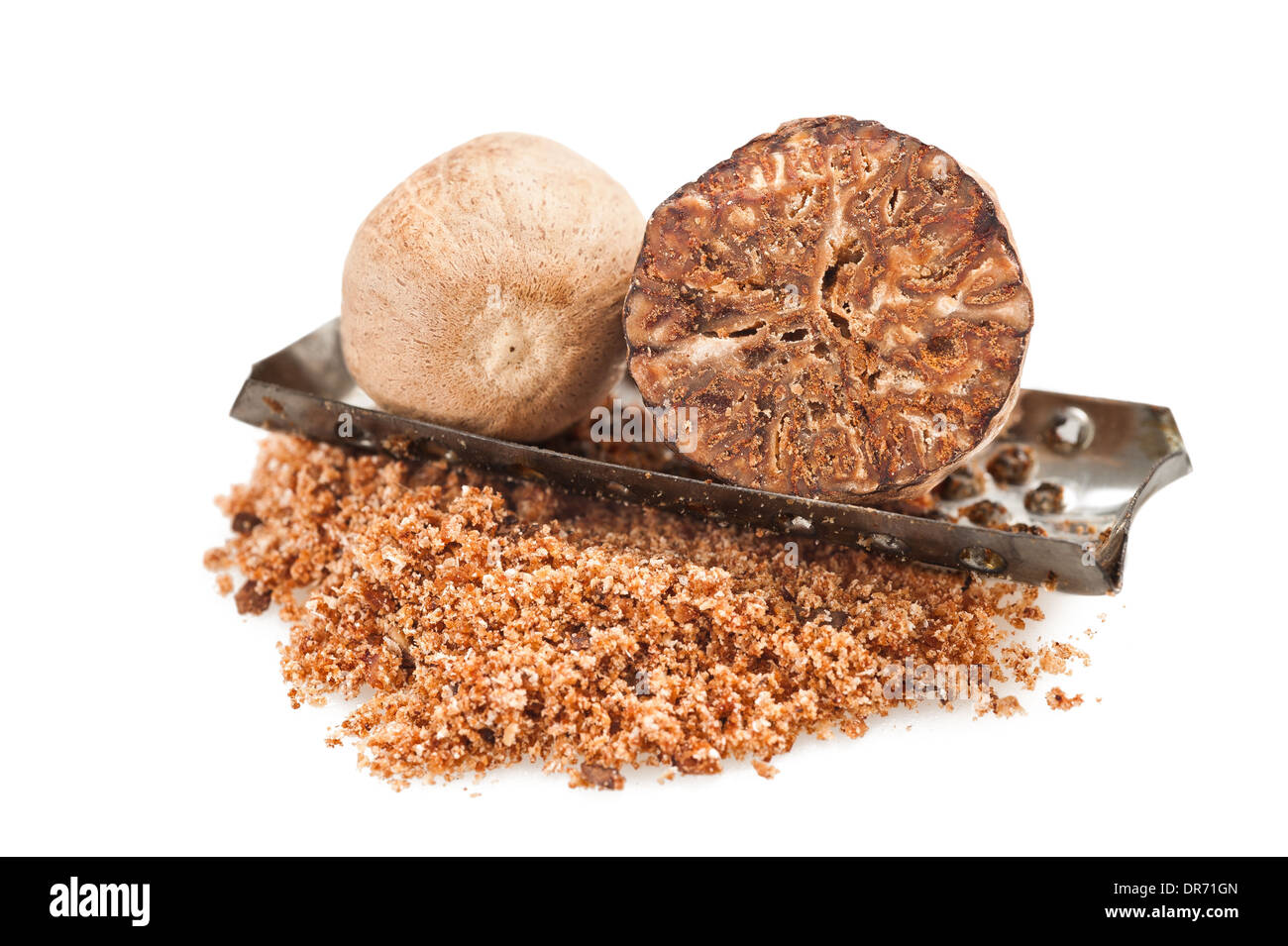 whole and grated nutmeg on white background Stock Photo