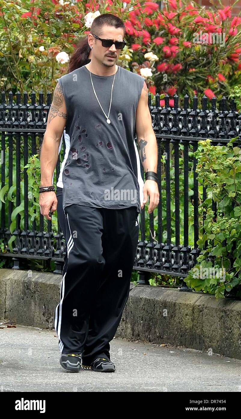 Colin Farrell  dressed casually in Adidas tracksuit bottoms as he goes for a power walk with his sister along Sandymount Strand  Dublin, Ireland - 05.07.12 Stock Photo