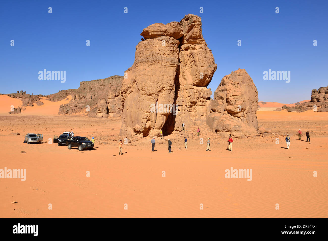 Algeria, Sahara, Tassili N'Ajjer National Park, Group of people at a rockart site Stock Photo