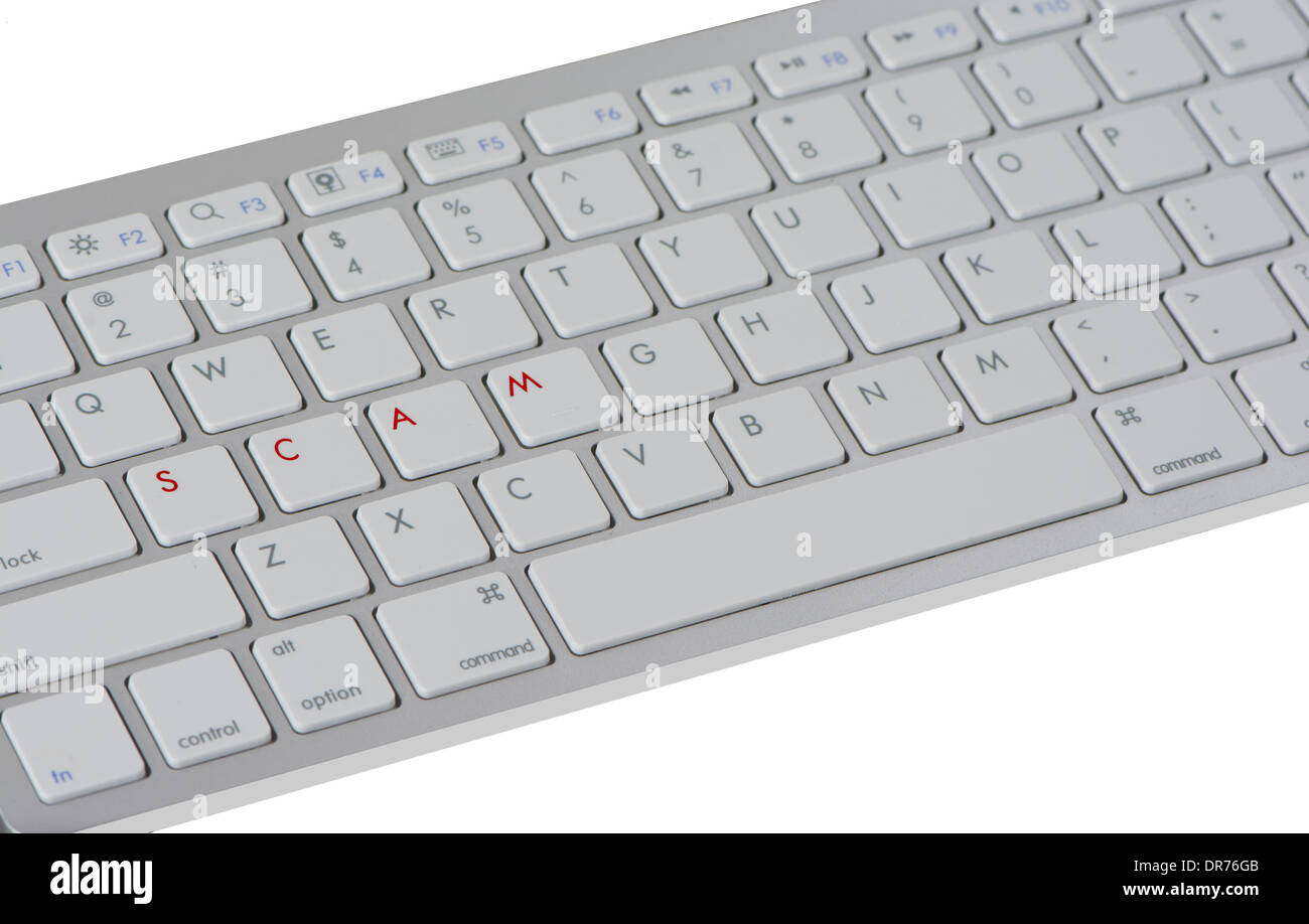 Computer Keyboard With Letters Spelling Out The Work Scam And Dislike Button Isolated On A White Studio Background Stock Photo