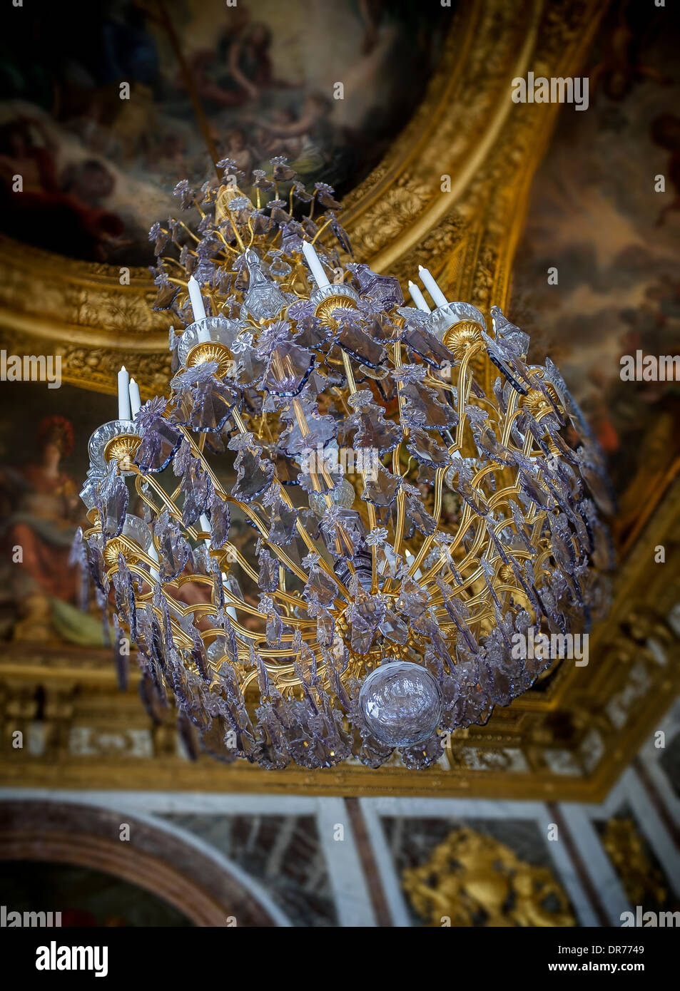 chandelier hangs in the hall of mirrors at versailles palace paris france Stock Photo