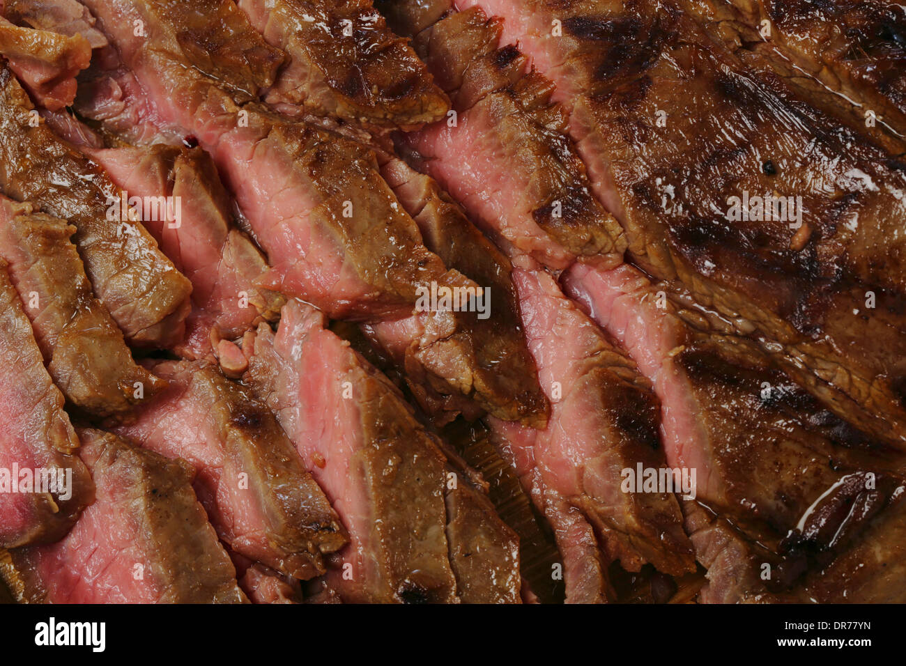 Thinly sliced marinaded and grilled flank beef steak, or London broil as it is known in the US Stock Photo