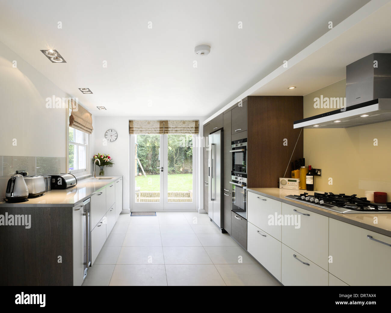 Modern kitchen with white fitted units Stock Photo