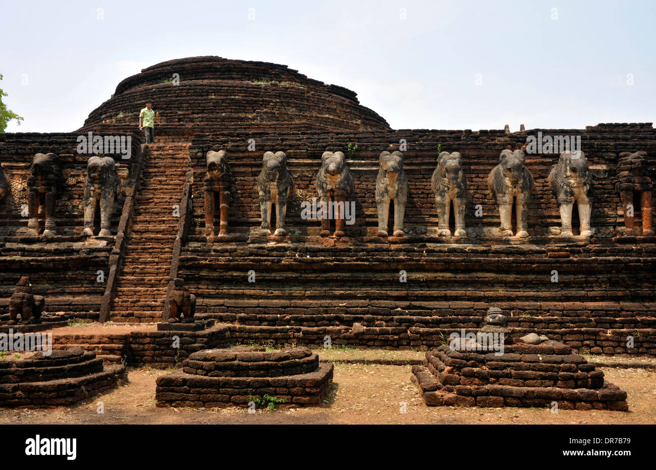Palace ruins adorned with elephant statues at Kamphaeng Phet in Thailand. Stock Photo
