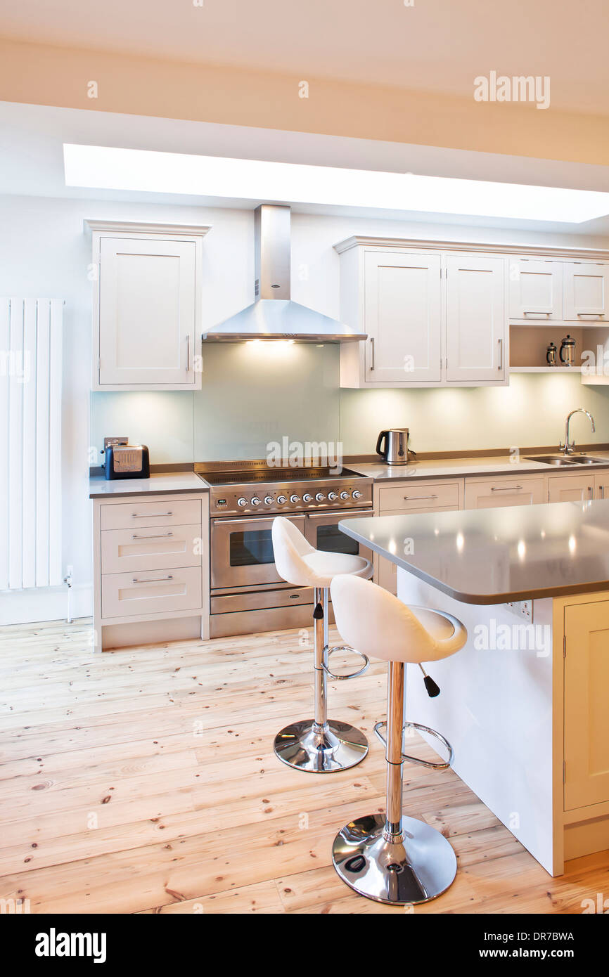 Bar stools at breakfast bar in modern kitchen, Pretoria Road Stock