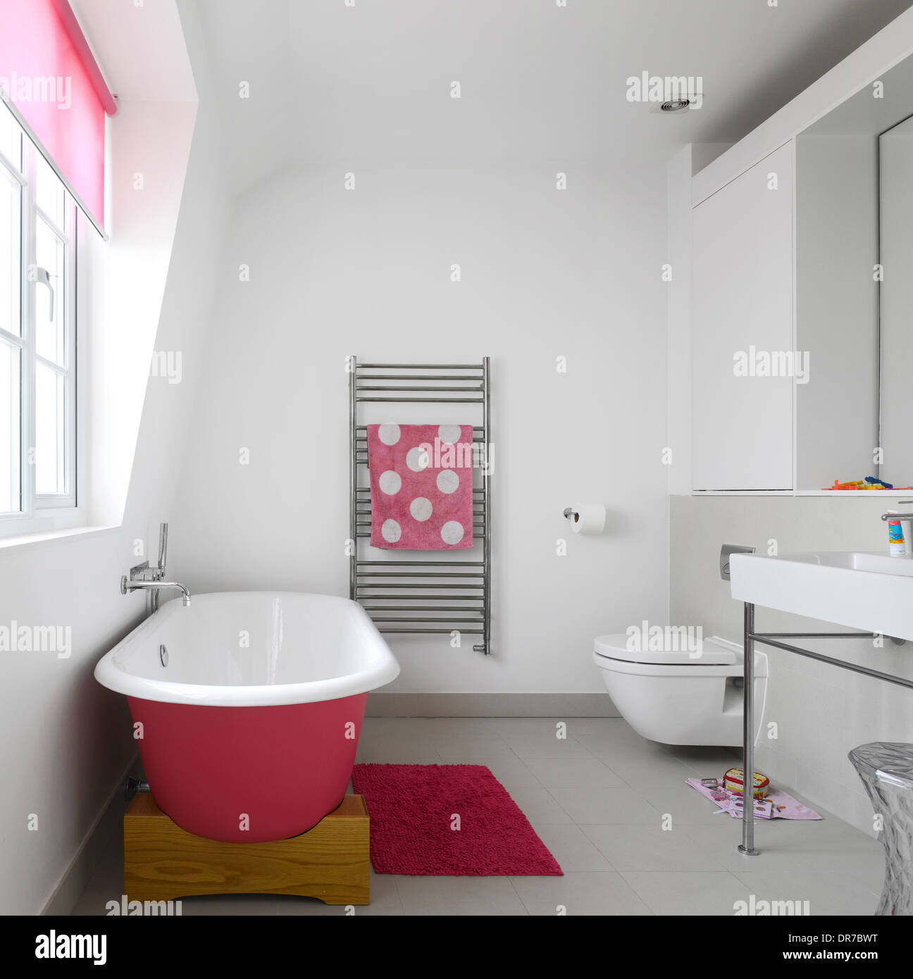Pink freestanding bathtub in children's Bathroom Stock Photo Alamy
