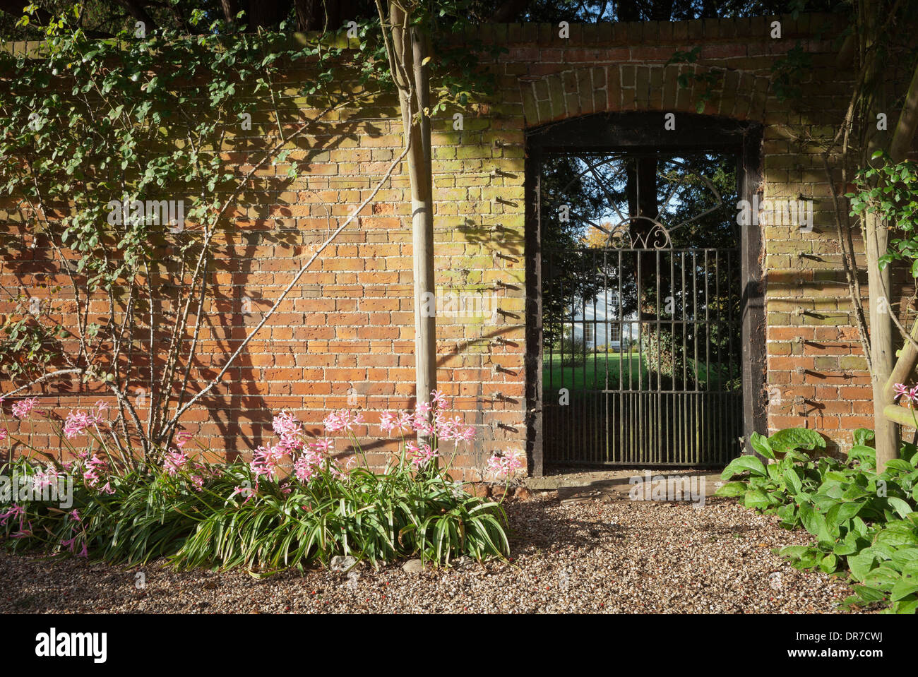 Wrought iron gate in brick wall, Spencers Stock Photo Alamy