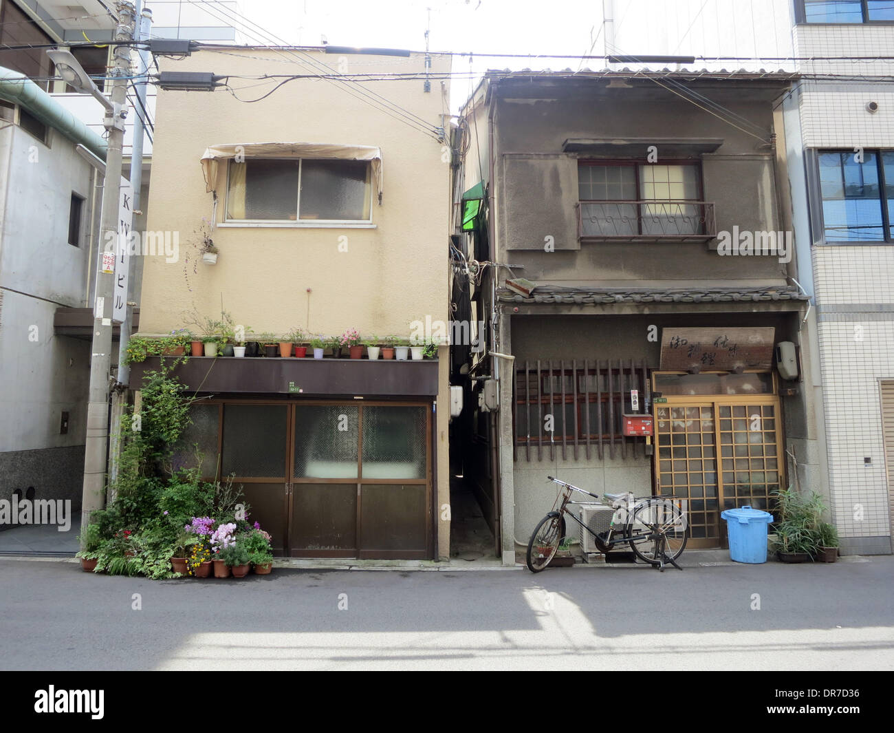 Osaka, Japan. 20th April, 2013. Two old houses stand next to Osaka, Japan. 20th April, 2013. Two old houses stand next to