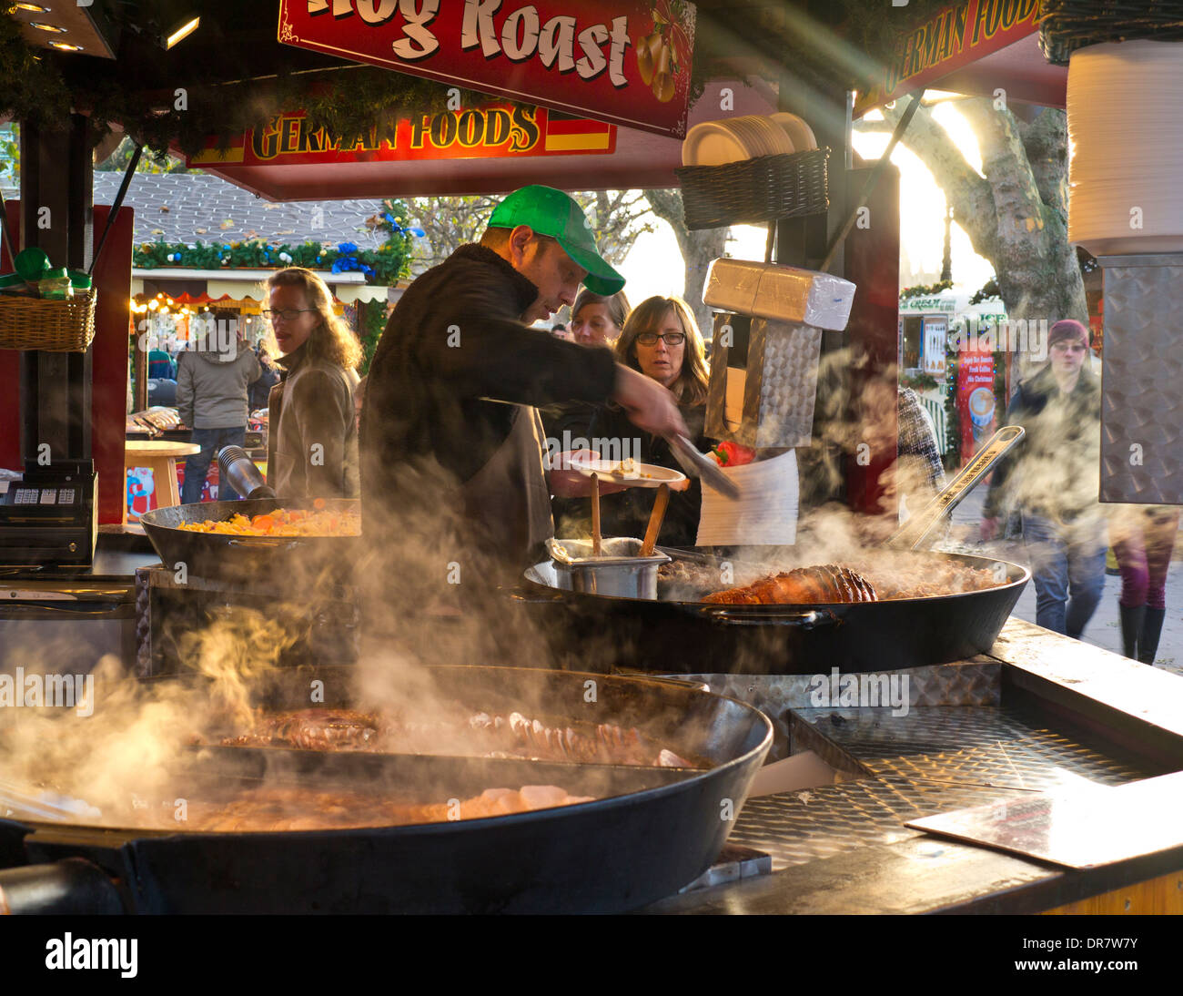 South Bank German Christmas market alfresco takeaway food stall and visitors London UK Stock Photo