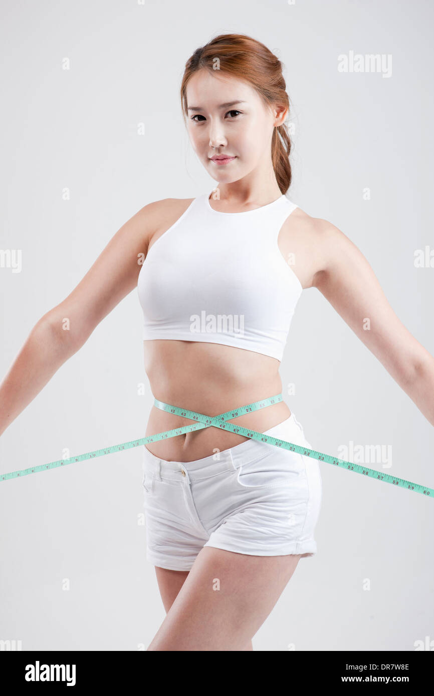 Woman measuring waist tape measure hi-res stock photography and images -  Page 3 - Alamy