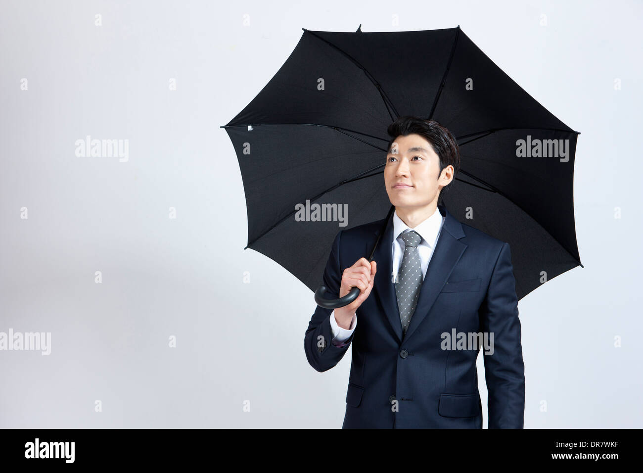 Black suit with umbrella hires stock photography and images Alamy