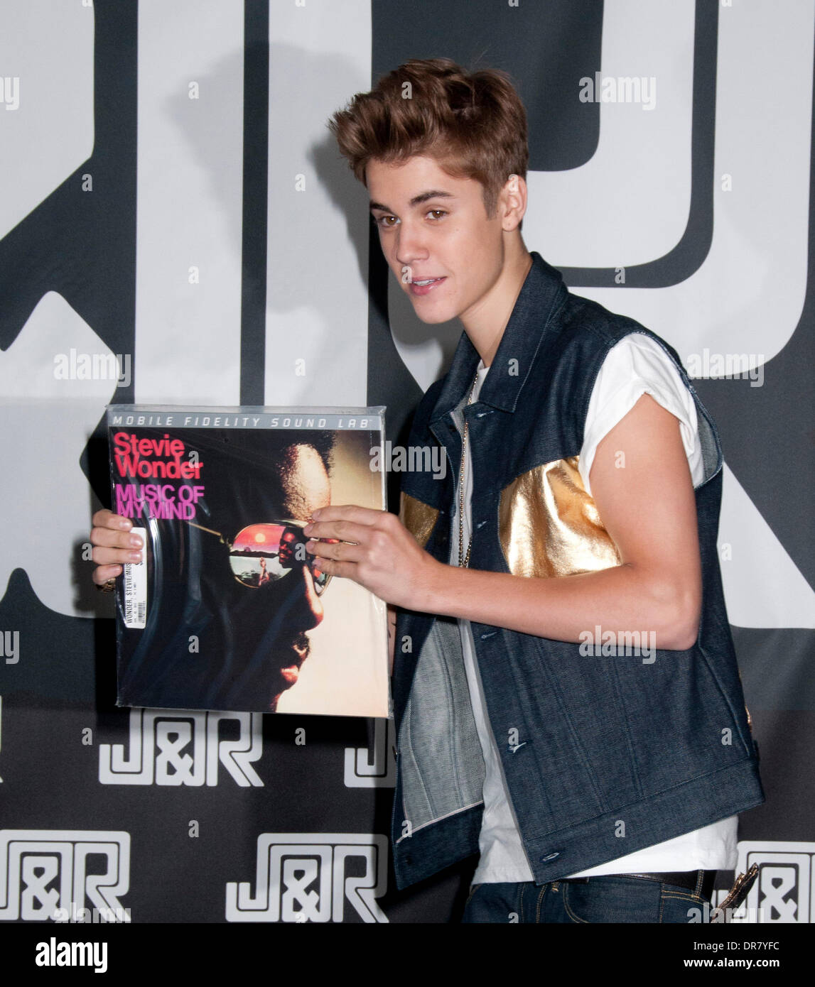 Justin Bieber signing autographs at JR Music World New York