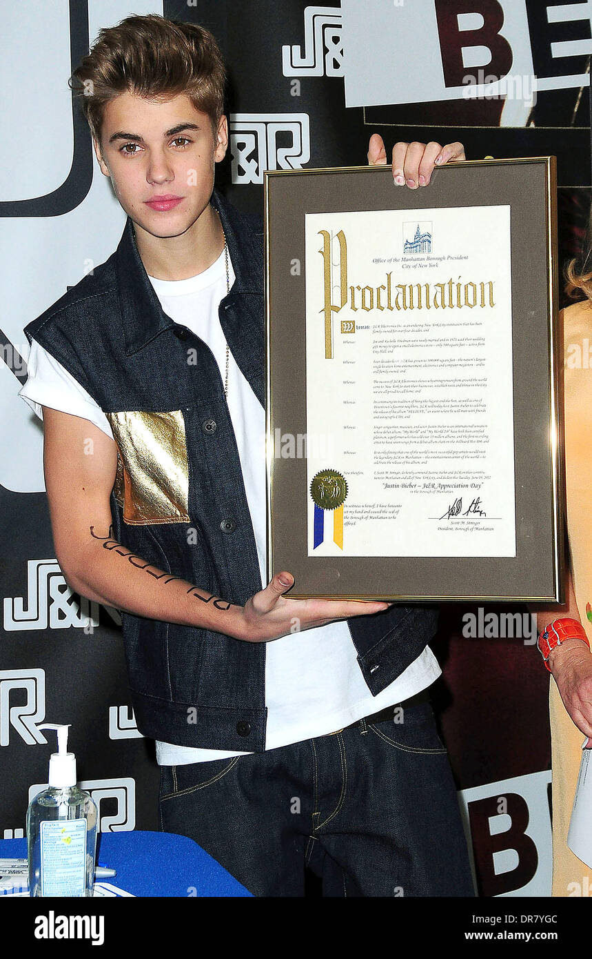 Justin Bieber signing autographs at JR Music World New York