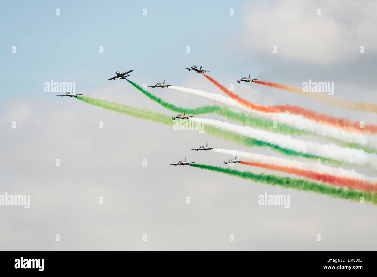 The Italian Military Aerobatic Display Team Il Frecce Tricolori trailing smoke trails perform their display at the 2013 RIAT Stock Photo