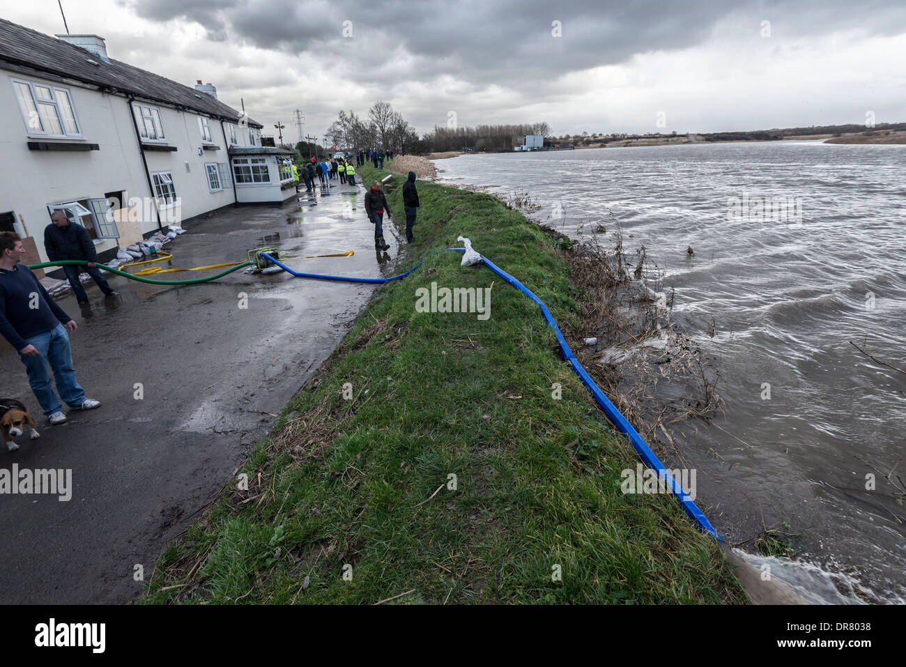 The Fiddlers Ferry Tavern by the River Mersey at Penketh recently flooded on Dec 5th 2013 under threat again. Stock Photo