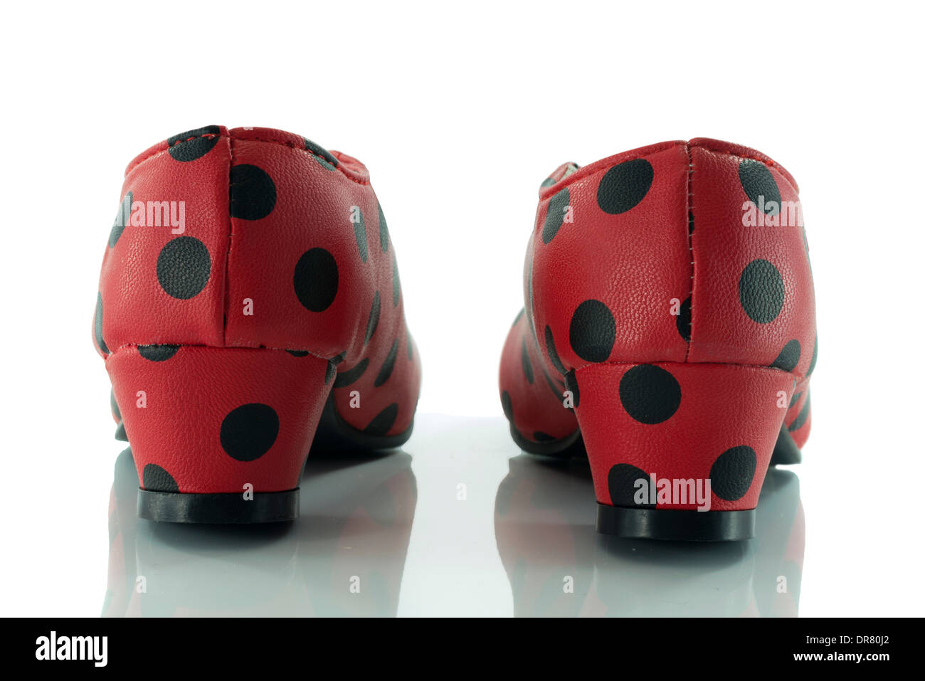 red shoes from back with black dots and white background Stock Photo