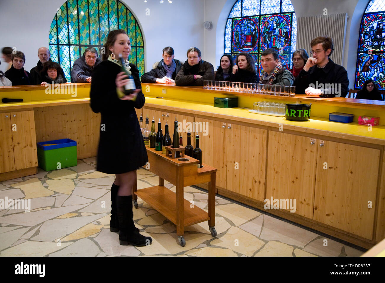 Tourists being served samples of Chartreuse liqueur at tourist factory