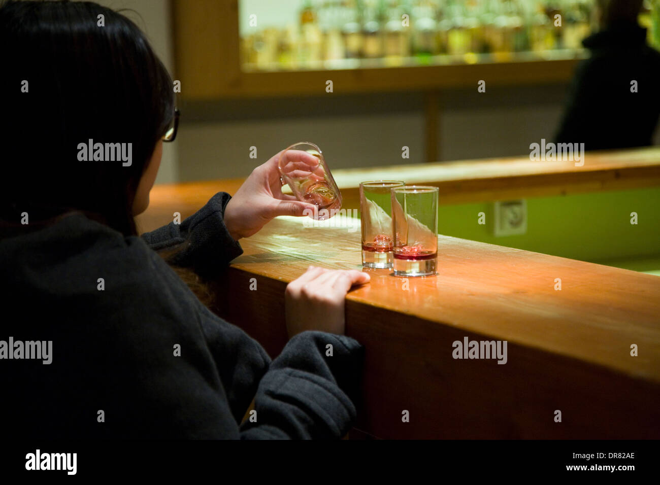 Tourists being served samples of Chartreuse liqueur at tourist factory