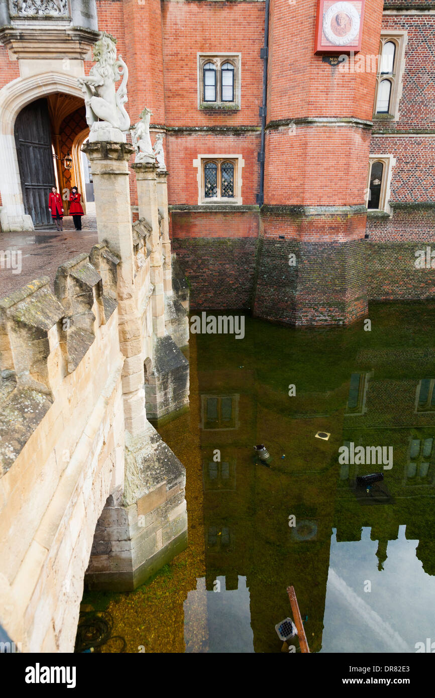 Gatehouse, & flooded moat of Hampton Court Palace filled deep with water after an unusually long spell of wet weather. Surrey UK Stock Photo