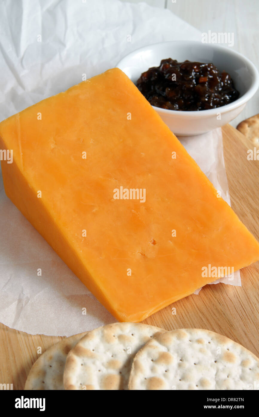 Red Leicester a traditional British cheese with crackers and pickle Stock Photo