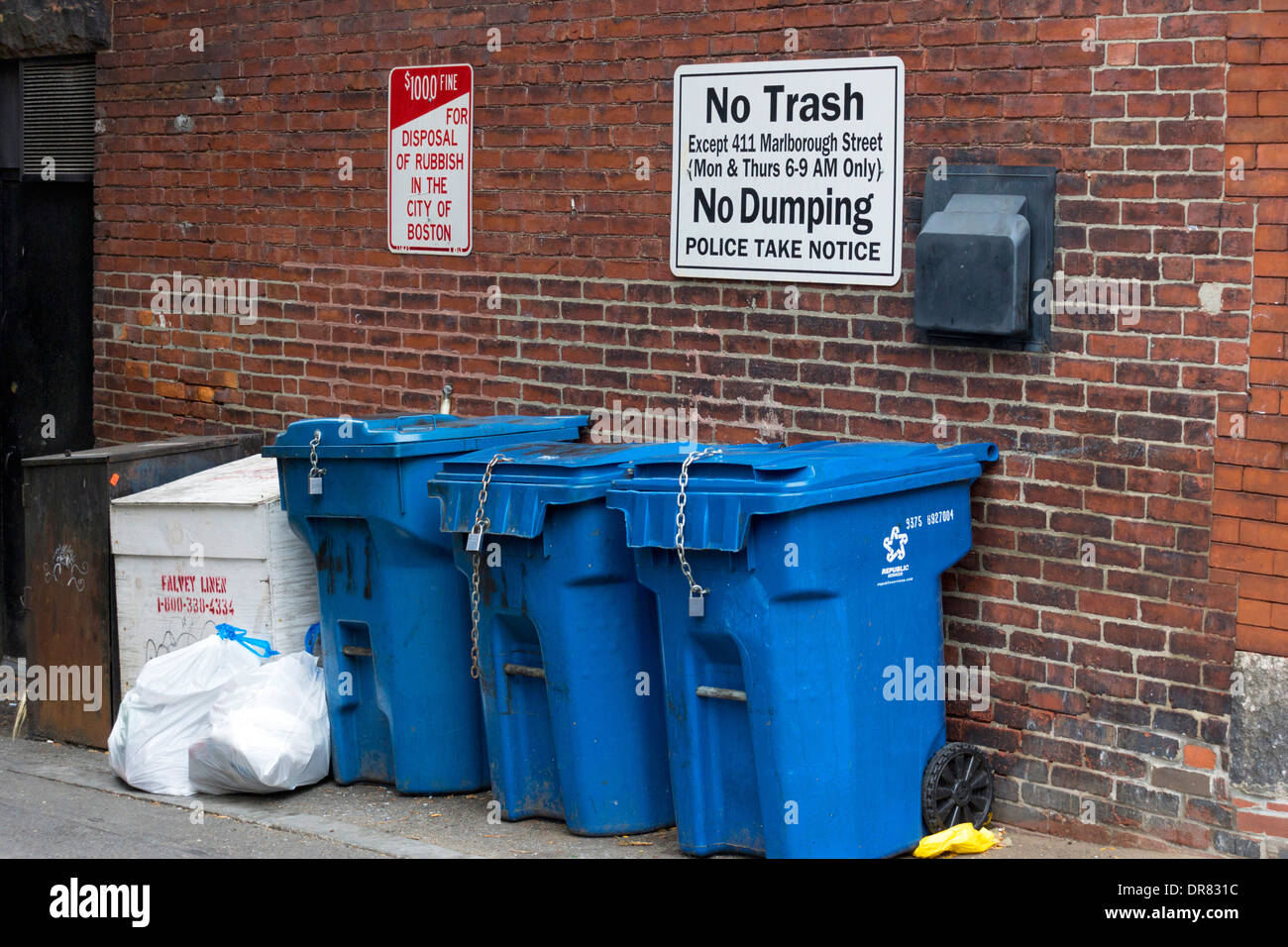 Blue rubbish bins in a lane in Boston, Massachusetts, USA Stock Photo