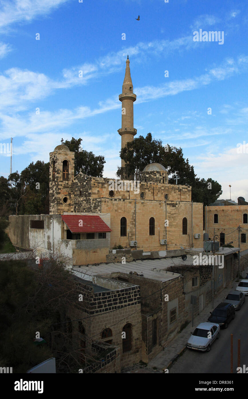 The old Irbid hill with church and minaret of the Mamluke mosque in the background. Irbid, northern Jordan, Middle East. Stock Photo