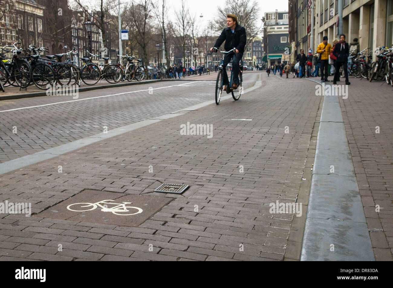 Cyclist on bike lane, Amsterdam Netherlands Stock Photo