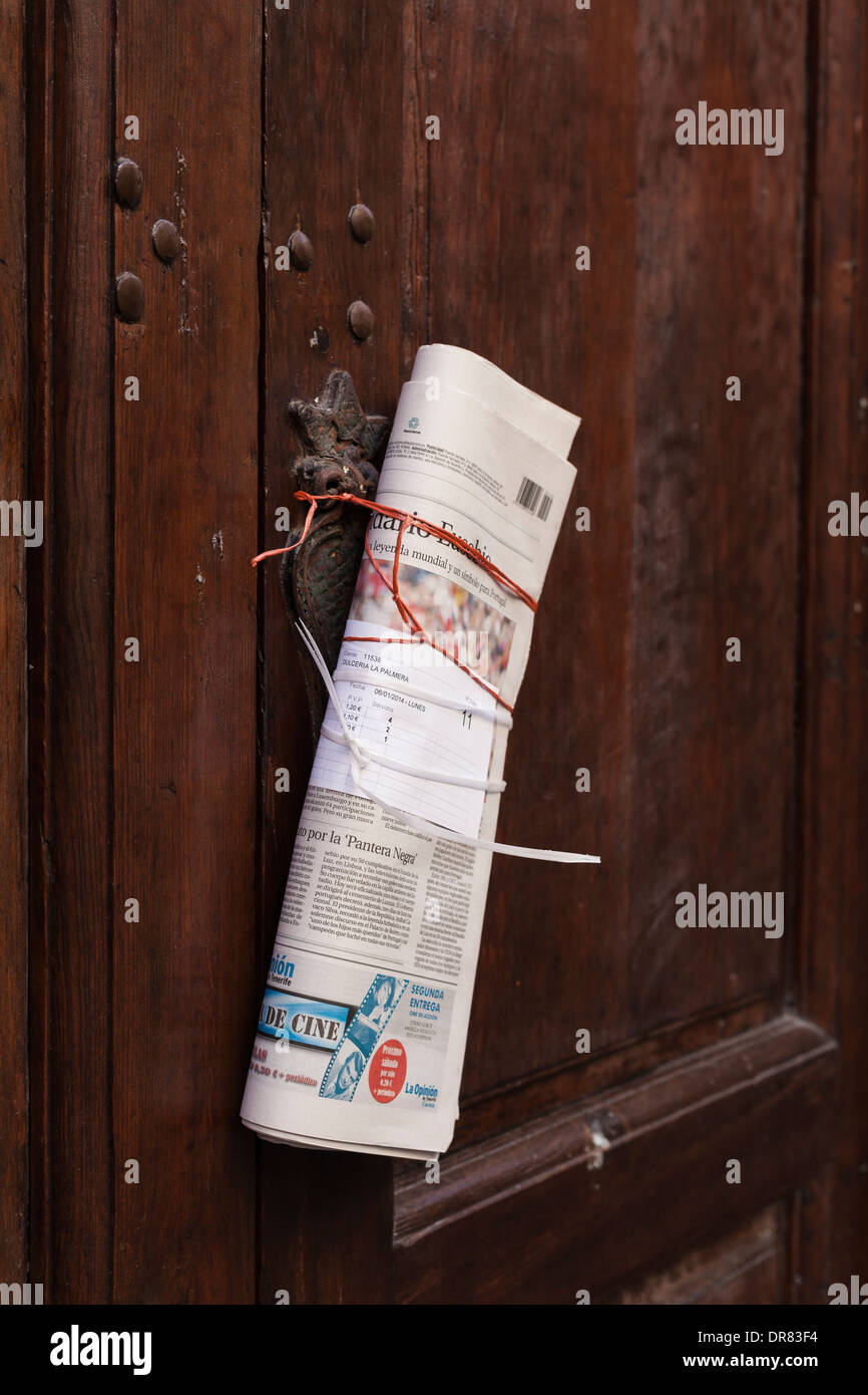 Newspaper hanging on the front door delivered early morning. Santa Cruz, La Palma, Canary Islands, Spain. Stock Photo