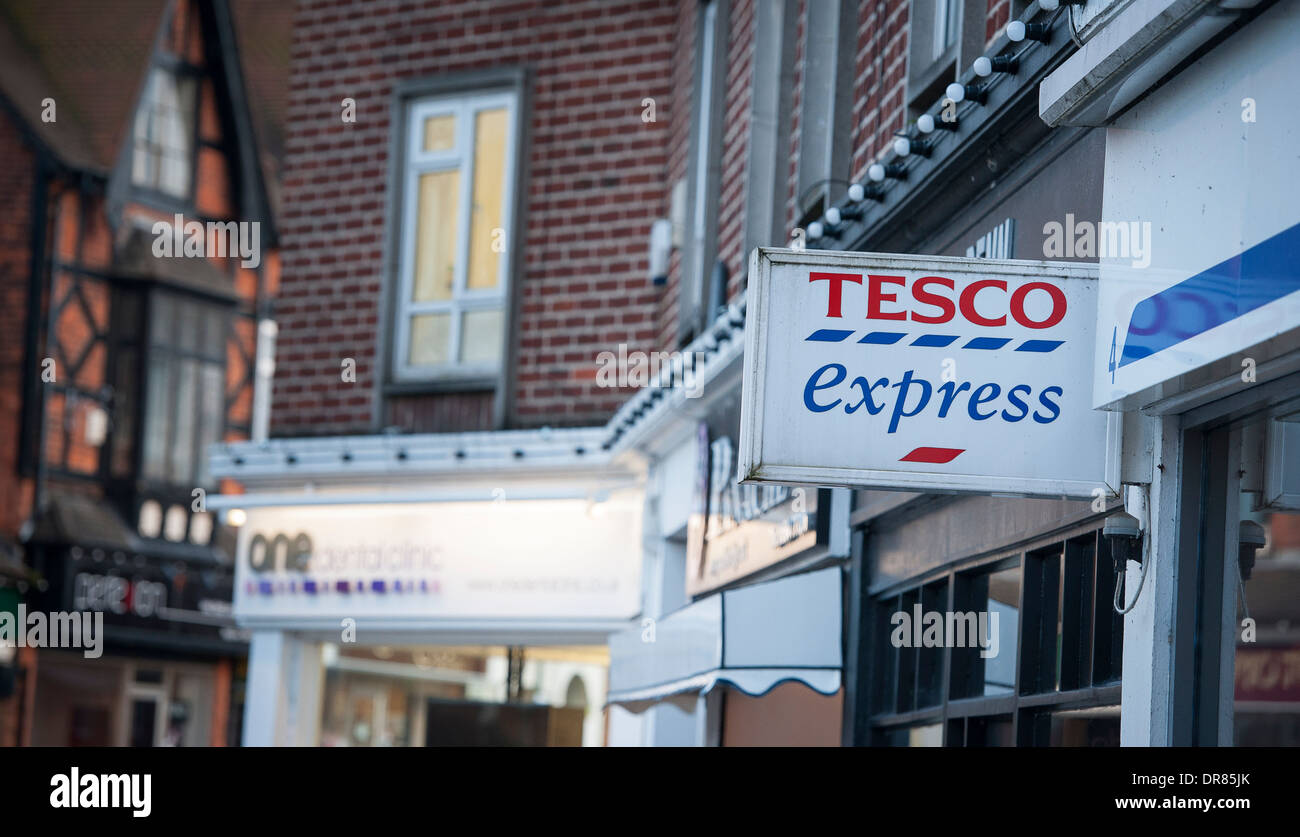 Tesco Express and other small shops in a town in England. Stock Photo
