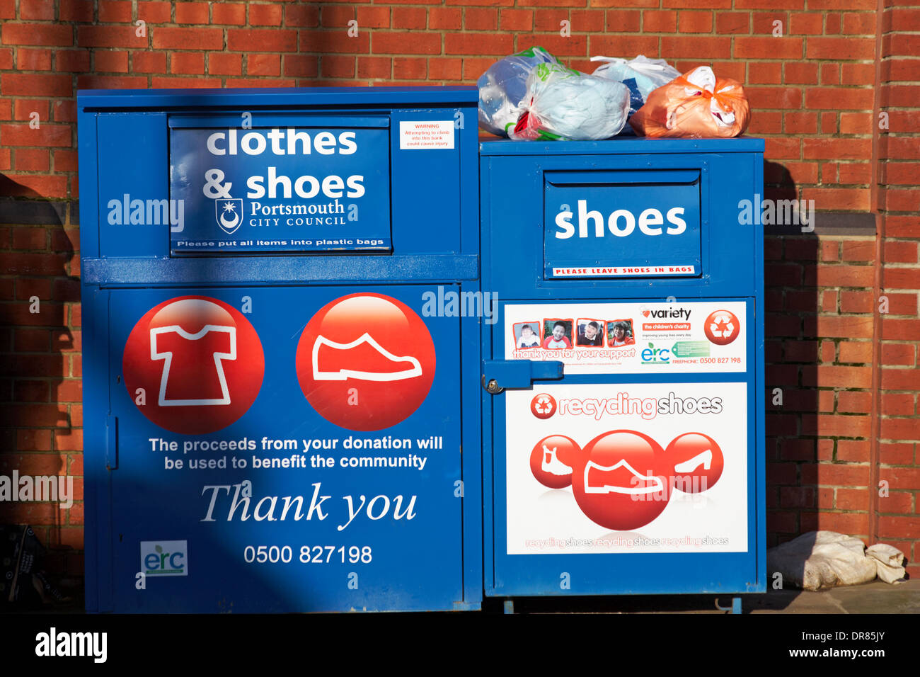 clothes & shoes recycling bank in car park at Portsmouth Stock Photo