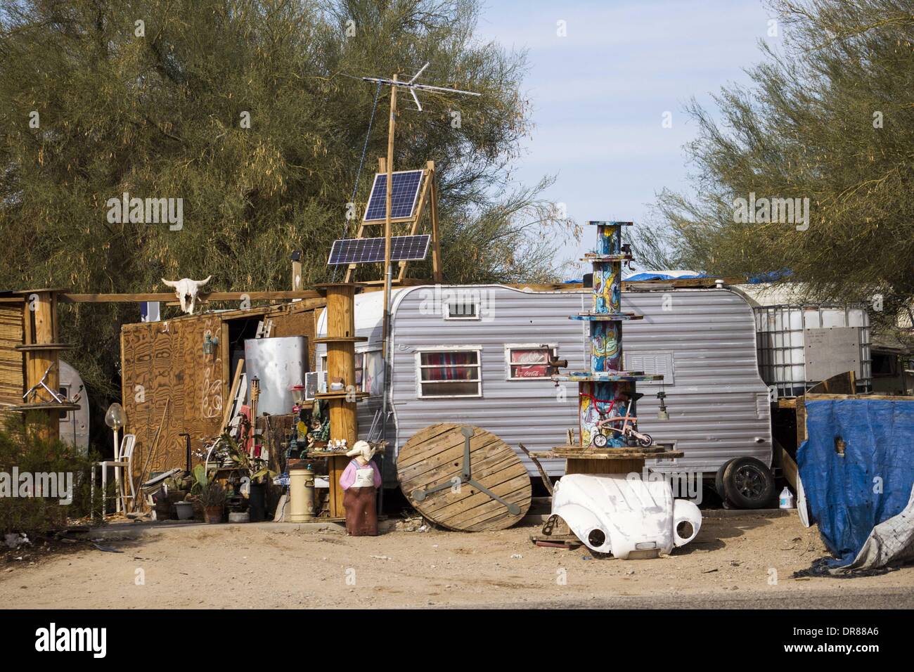 Jan. 4, 2014 - Palm Springs, California, U.S - A mobile home is seen on  January 4, 2014, in Slab City, California. Slab City or The Slabs is a snowbird campsite in the Colorado Desert in southeastern California, used by recreational vehicle owners and squatters from across North America. It takes its name from the concrete slabs that remain from the abandoned World War II Marine barracks of Camp Dunlap. (Credit Image: © Ringo Chiu/ZUMAPRESS.com) Stock Photo