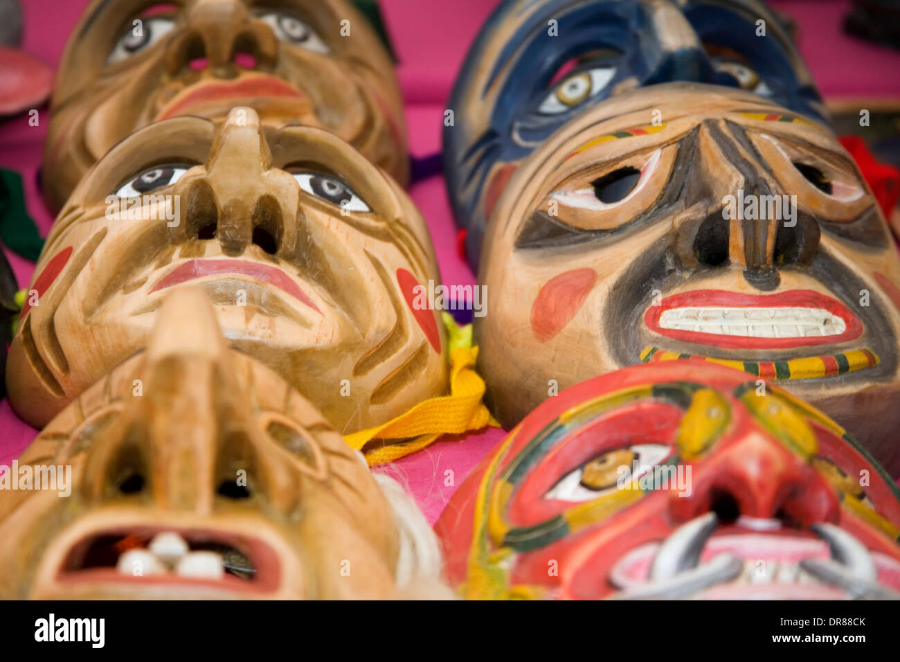 Wooden masks (by Pedro and Javier Gonzales, Peru), International Folk Art Market, Santa Fe, New Mexico USA Stock Photo