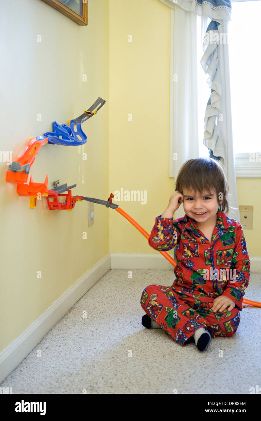 Toddler Sitting With His Hot Wheels Track Stock Photo