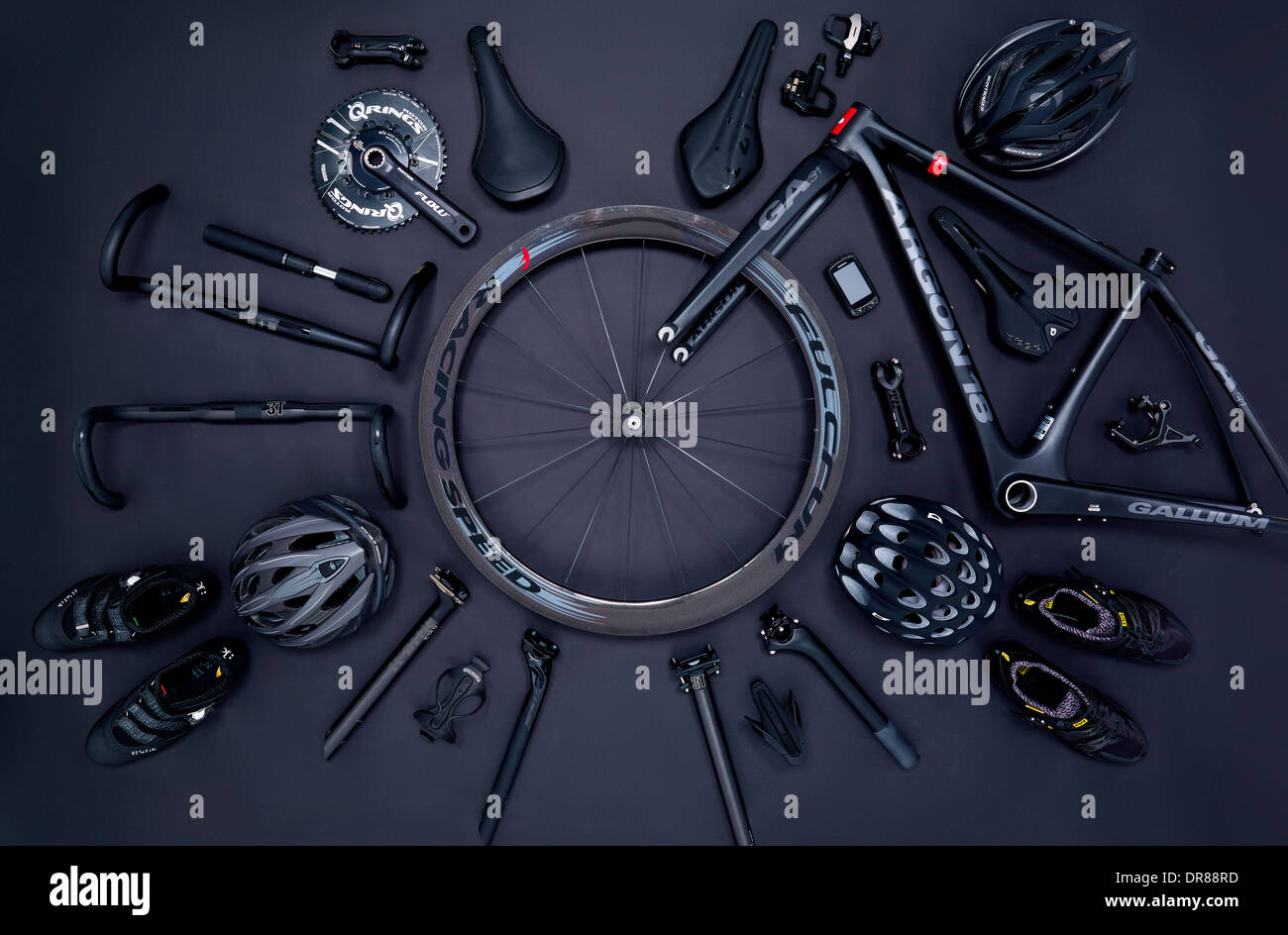 Road bike parts and accessories on a black background Stock Photo - Alamy