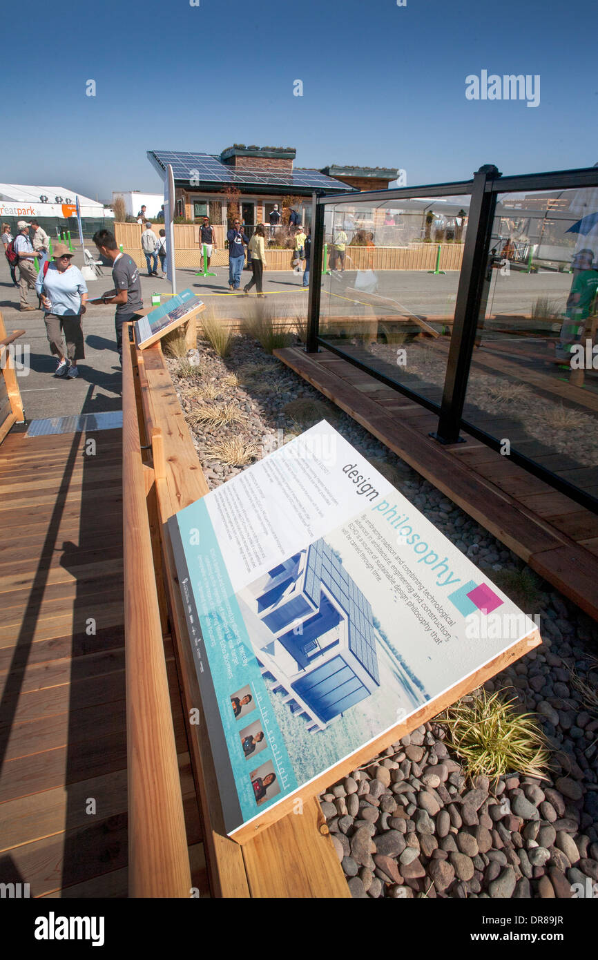 Signs depicting the design philosophy of an experimental energy efficient solar powered home at the Solar Decathlon in Irvine, CA, frame a competing home designed by students from West Virginia University on exhibit.  The international competition is spon Stock Photo