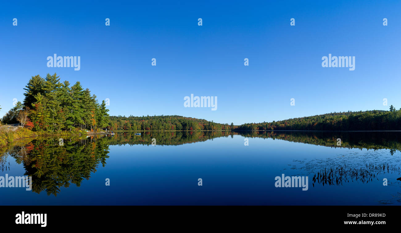 Sanford Pond in Morrill Maine in the late summer with trees starting to